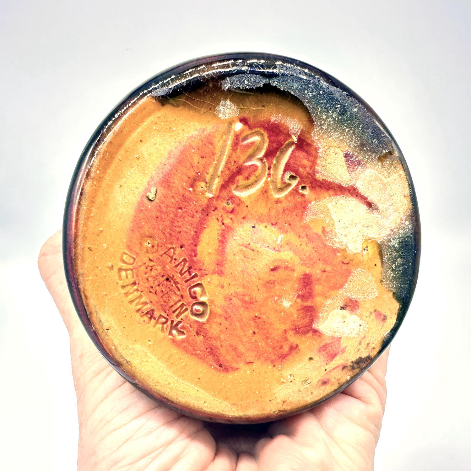 Danico vase base signature mark and bottom interior glaze, showing maker's mark and patina