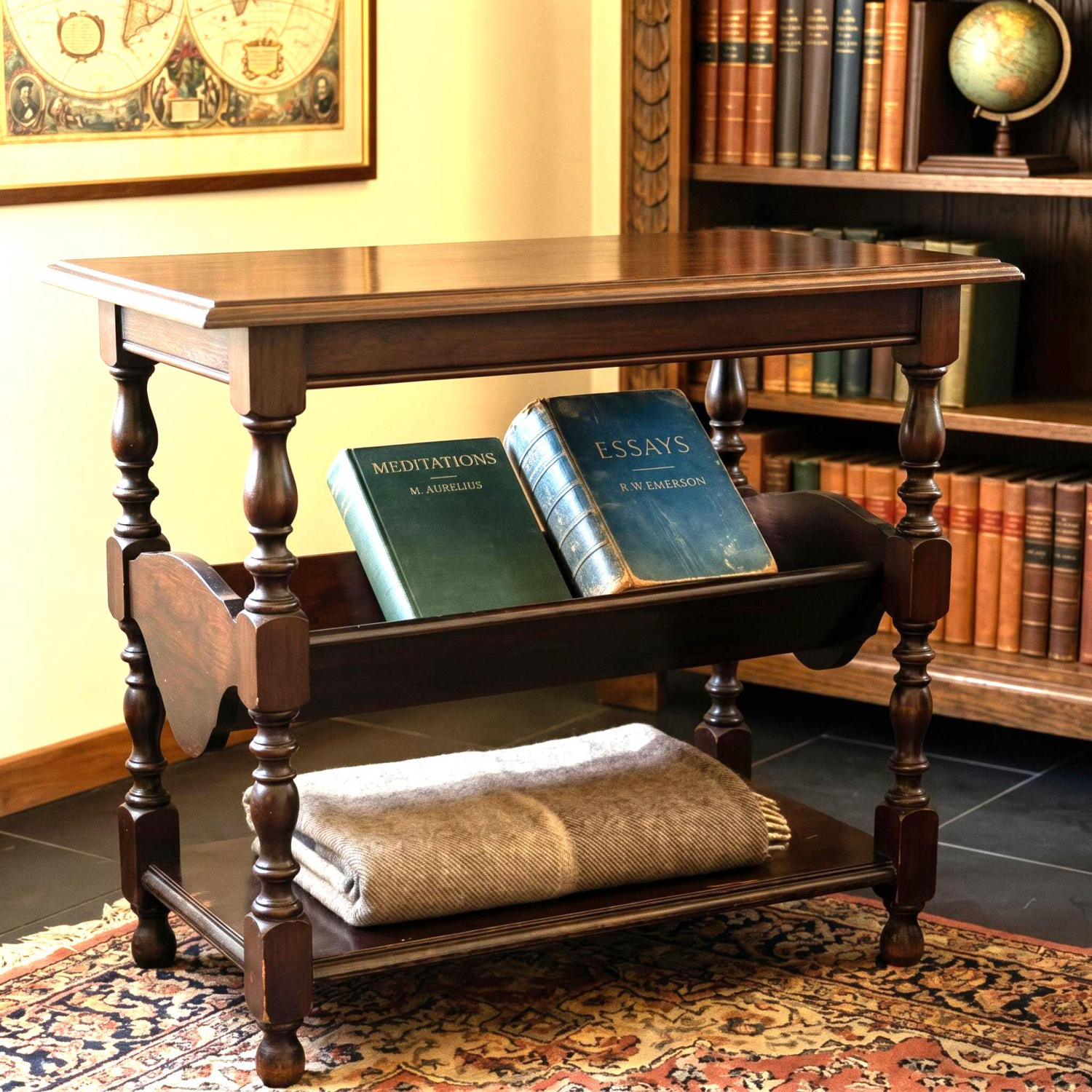 Dark wood Shaker-style side table with turned legs, book rack shelf, and lower storage tier in period room setting