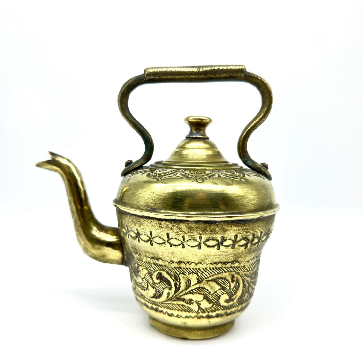 Ewer and basin three-quarter view showing both pieces' construction, engravings, and how ewer sits within the basin's embrace
