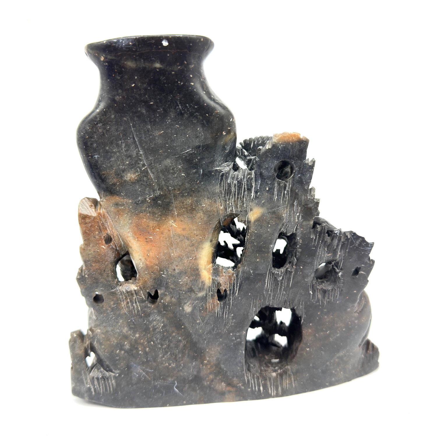 Frontal view of twin soapstone vessels with flowering branch carving and open apertures, symmetrical composition