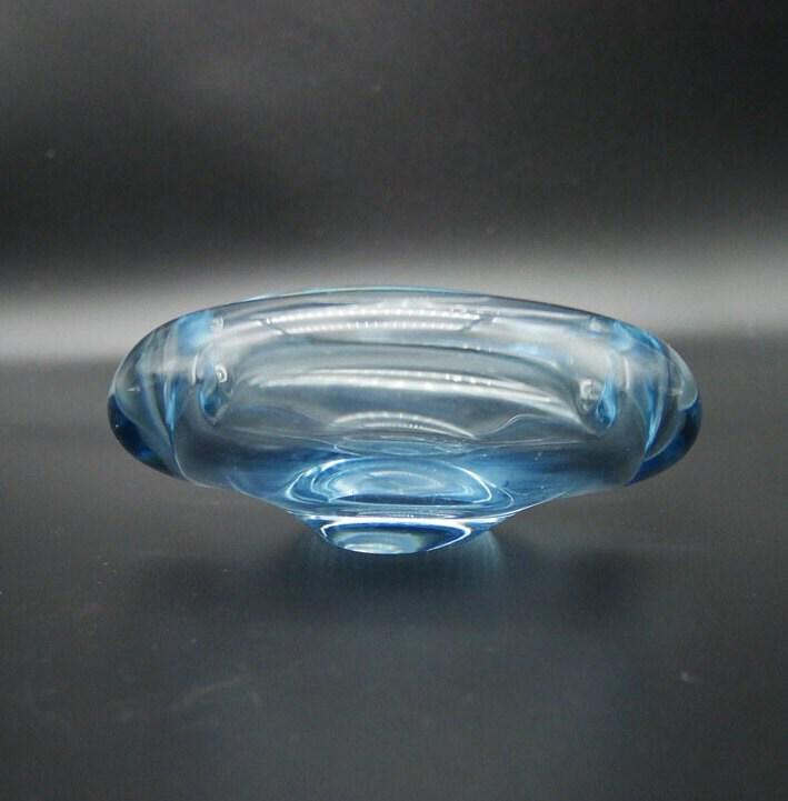 Holmegaard ashtray photographed from directly above showing interior surface and light transmission quality
