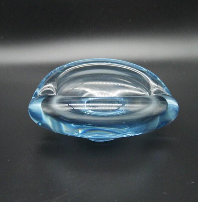 Holmegaard crystal bowl flat view showing continuous oval outline and translucent ice-blue coloration throughout