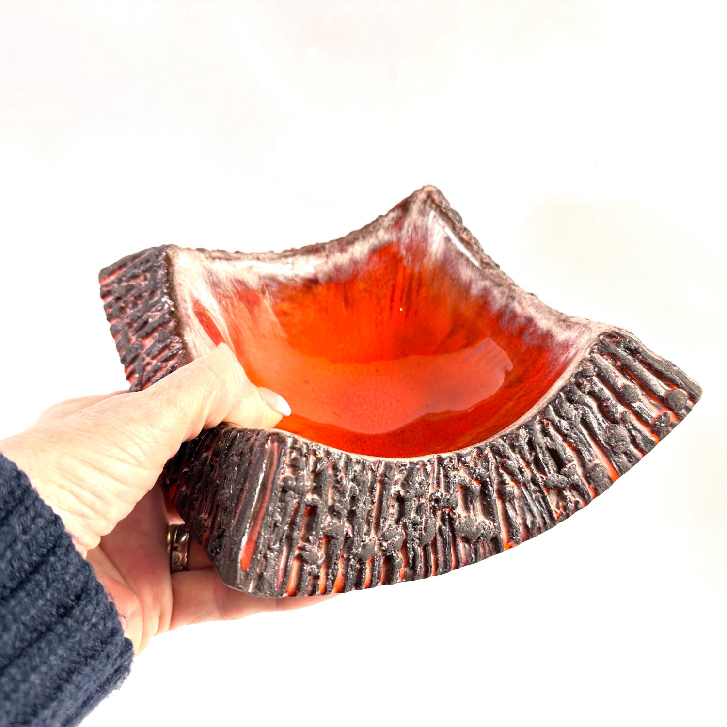 Norrmans Keramik lava glaze bowl, Swedish 1960s studio pottery with vibrant orange-red molten glaze and textured charcoal rim
