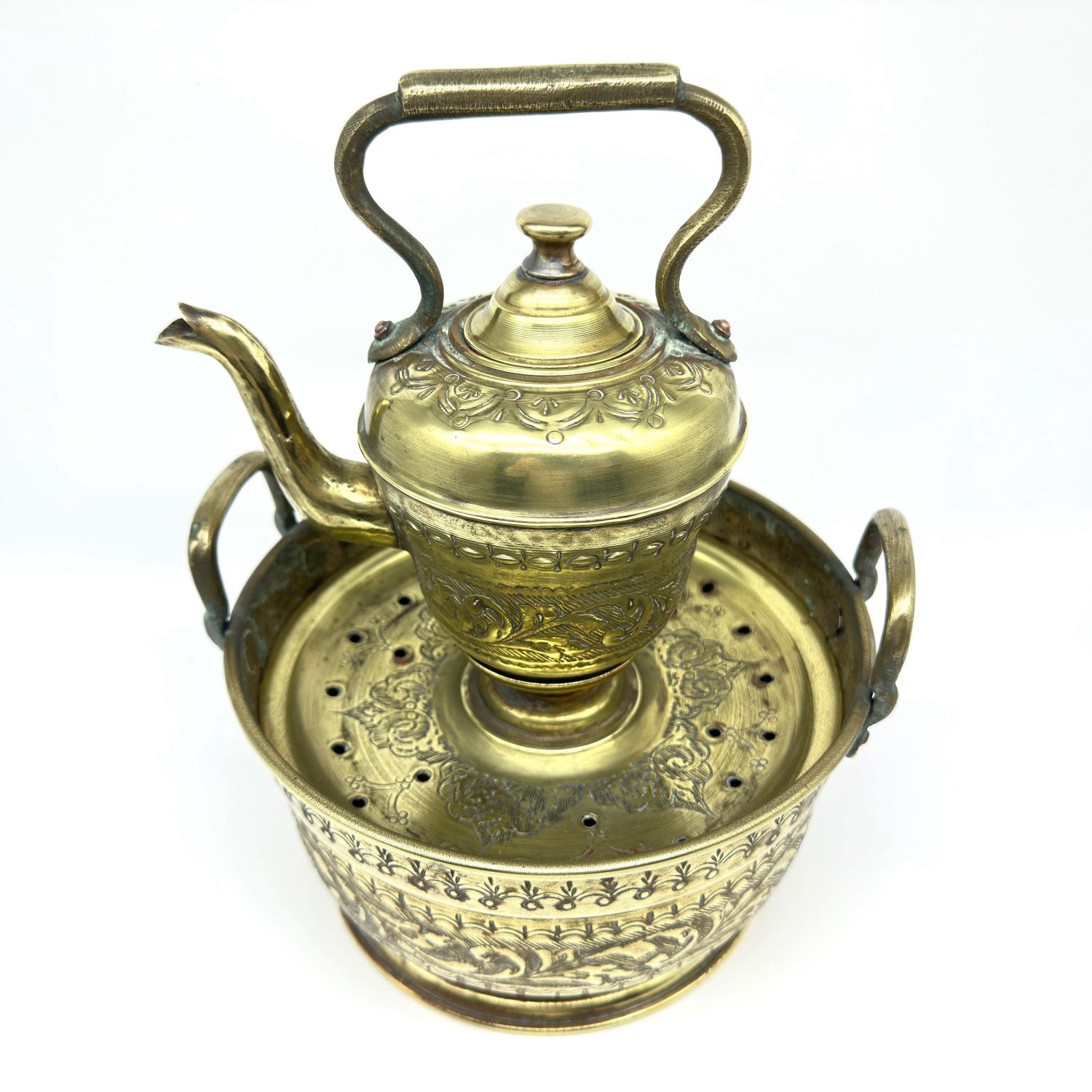 Overhead perspective of basin with ewer centered, showing punched detailing on basin rim and ewer's domed lid construction