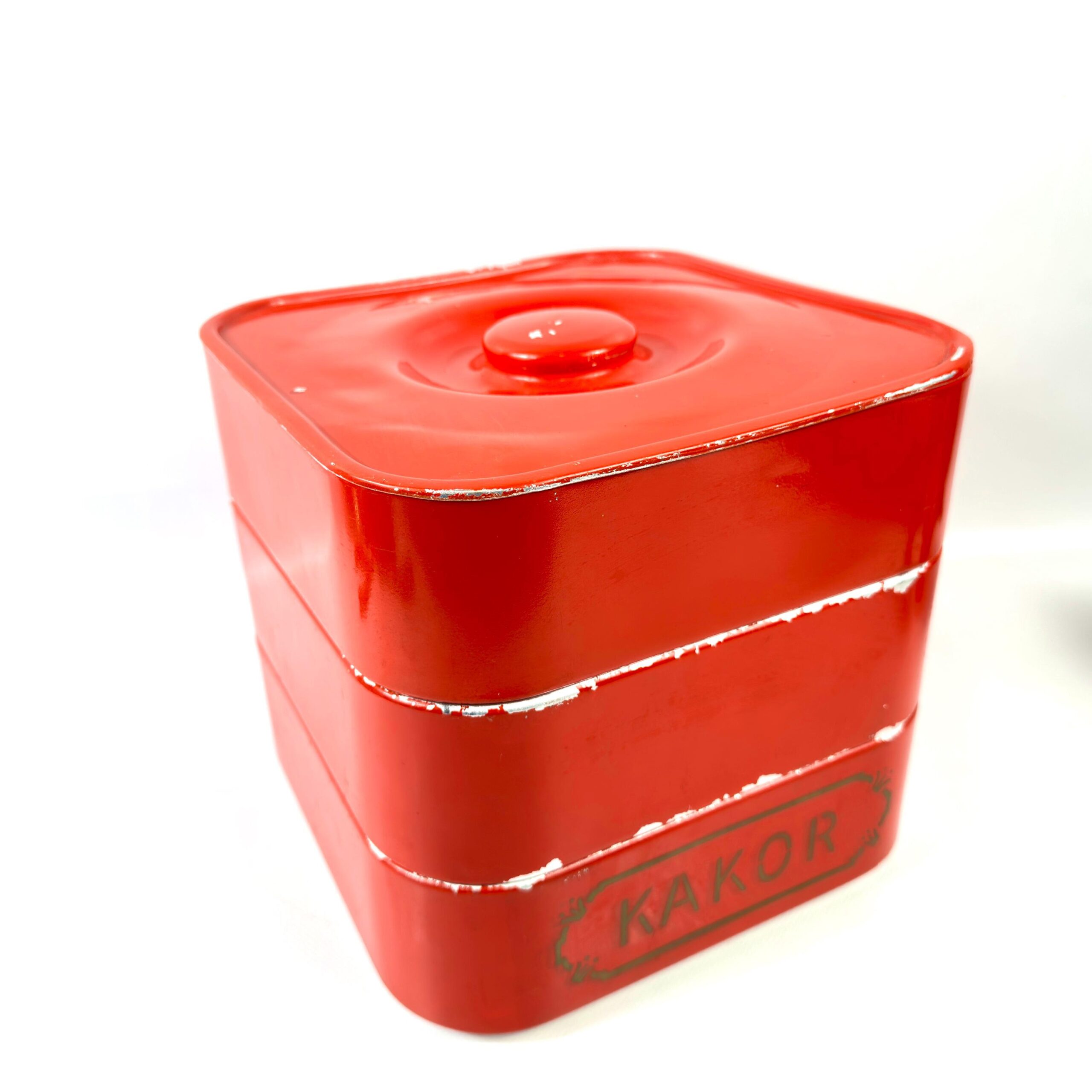 Swedish red painted metal cookie tin marked KAKOR, 1950s vintage biscuit storage with rounded square form and fitted lid