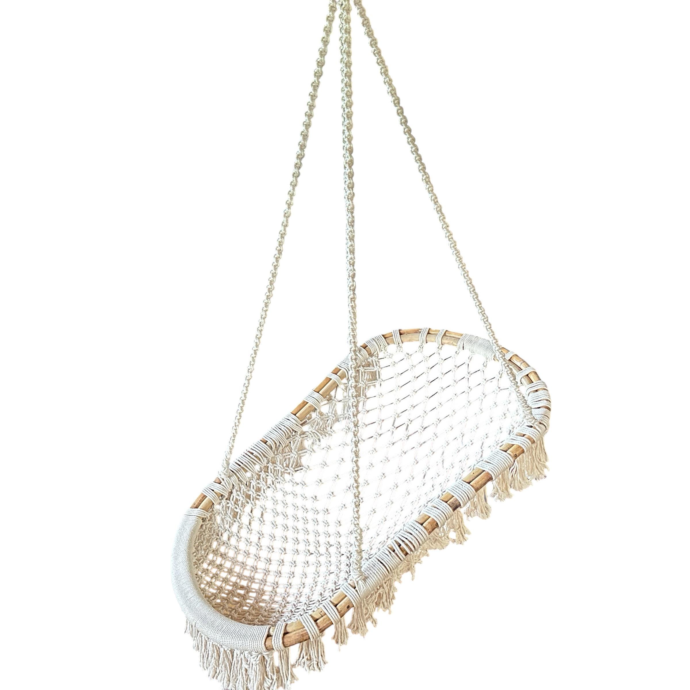 Final angled view of complete vintage macramé hanging chair with full seat visible and rope suspension system showing